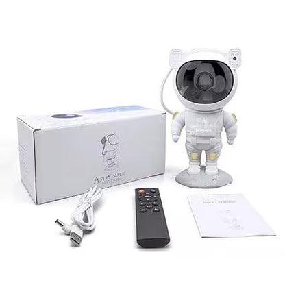 White astronaut-shaped camera with packaging, remote control, and cables on a white background